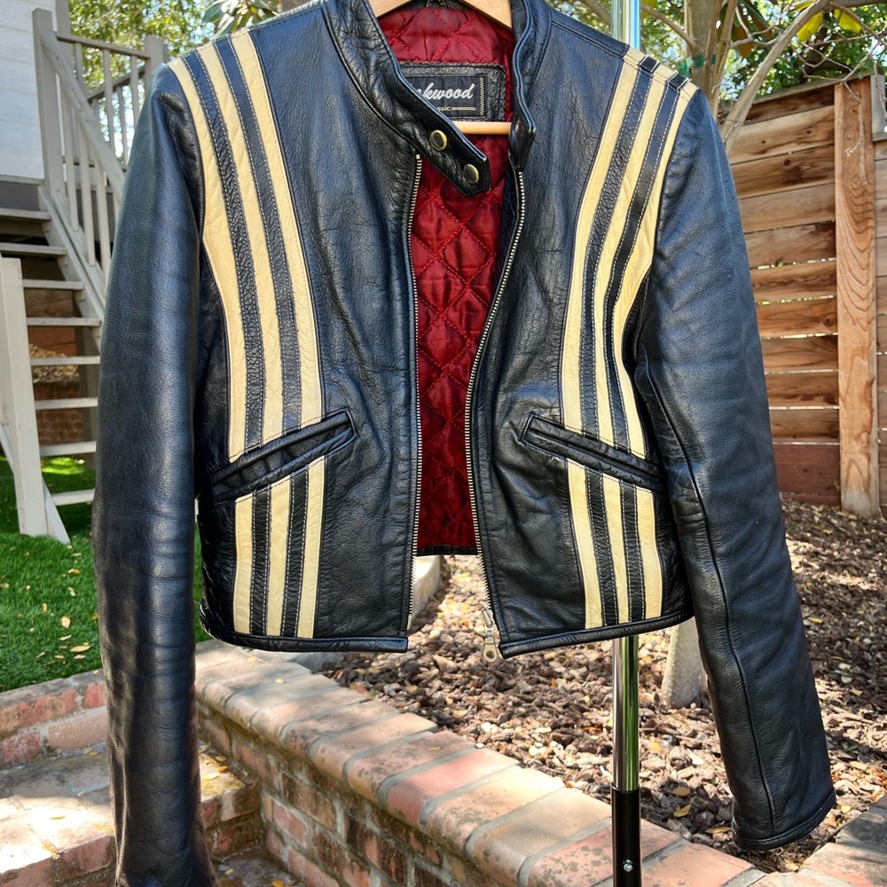 Chic Black Leather Jacket with Gold Accents